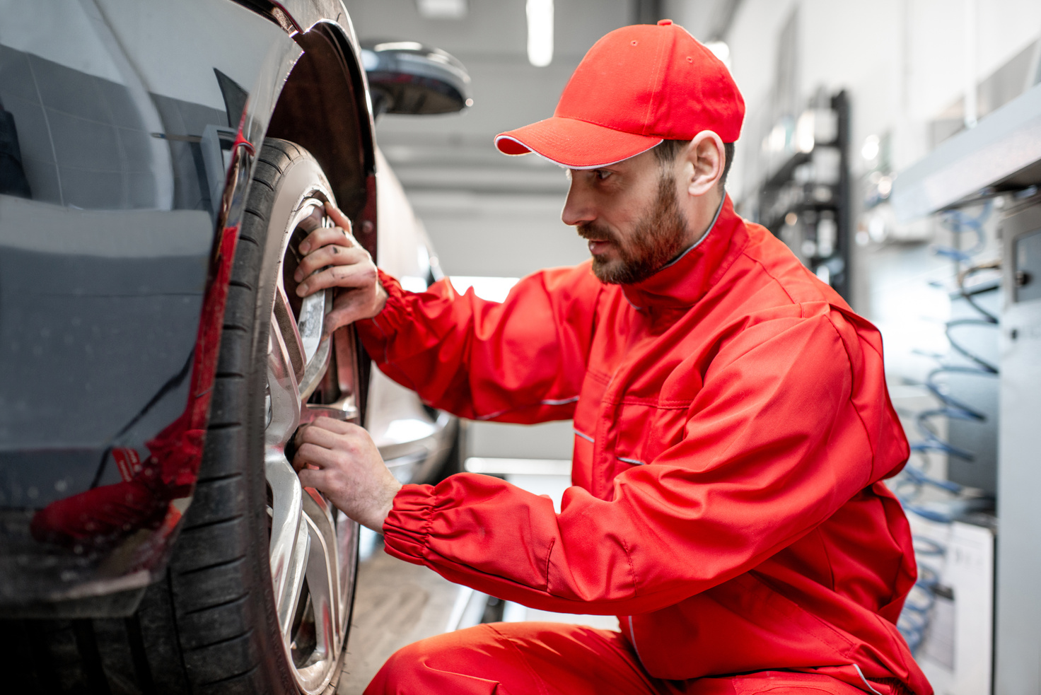 Car Mechanic Checking the Tires